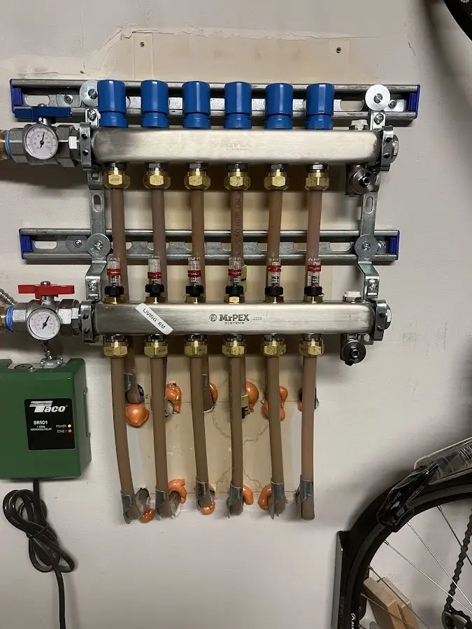 Plumber performing Water Heater Repair at a residential property in Luzerne